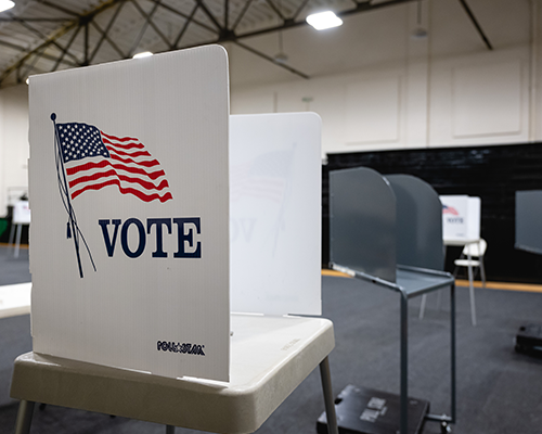 voting booth that reads "vote"